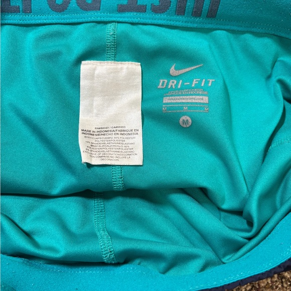 Nike Dri-FIT running shorts in navy blue with a teal waistband and trim large - Picture 5 of 5